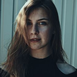 Close-up portrait of young woman with eyes closed