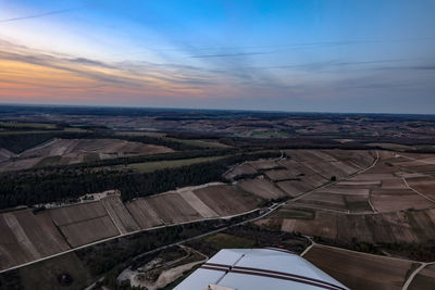 Aerial view of landscape seen through airplane window