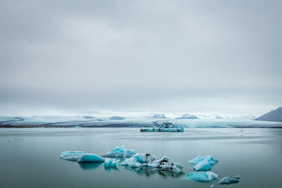 Scenic view of sea against sky during winter