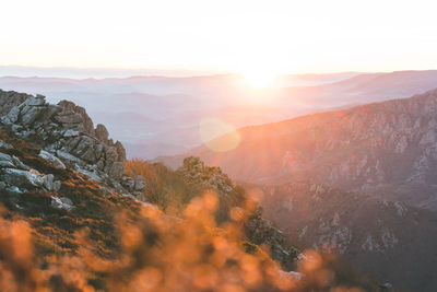 Scenic view of mountains against sky during sunset