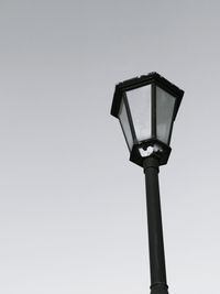 Low angle view of street light against clear sky