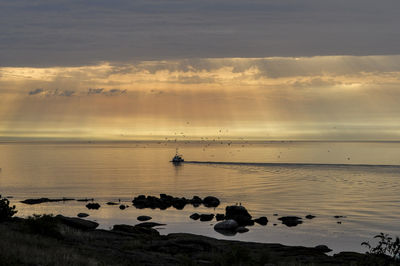 Scenic view of sea against sky at sunset