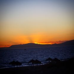 Scenic view of sea at sunset