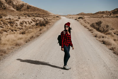 Full length of woman on road