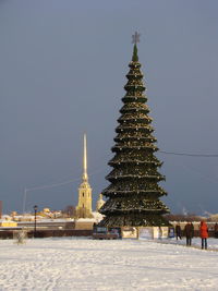 View of illuminated building against clear sky during winter