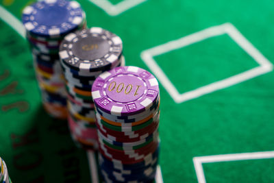 Close-up of colorful gambling chips on table