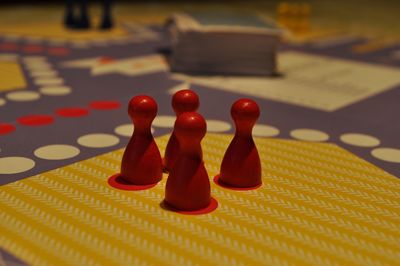 Close-up of chess pieces on table