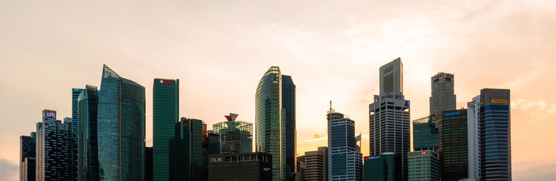 Panoramic view of modern buildings against sky in city