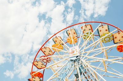 Low angle view of ferris wheel against sky