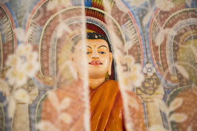 Close-up of buddha statue in store