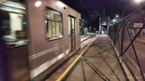 Train at railroad station at night