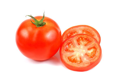 Close-up of tomatoes against white background