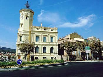 Low angle view of historic building against blue sky