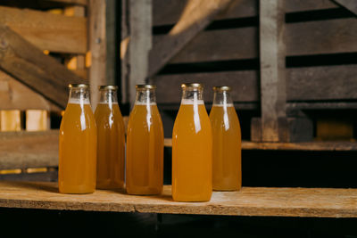Close-up of beer bottles on table