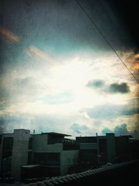 Low angle view of building against cloudy sky