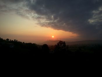 Scenic view of silhouette landscape against sky during sunset