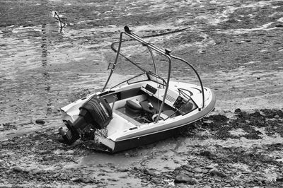 High angle view of abandoned boat moored on shore