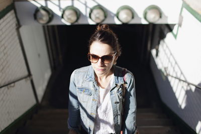 High angle view of woman standing on steps