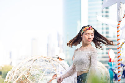 Young woman standing outdoors