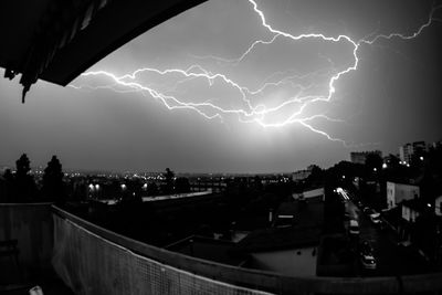 Lightning over buildings in city at night