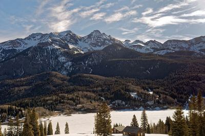 Scenic view of snowcapped mountains against sky during winter