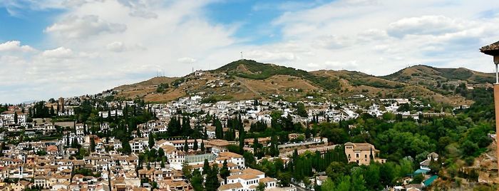 Town against cloudy sky