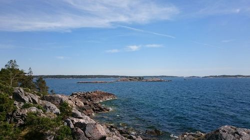 Scenic view of sea against blue sky