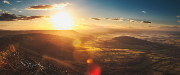 Scenic view of landscape against sky during sunset