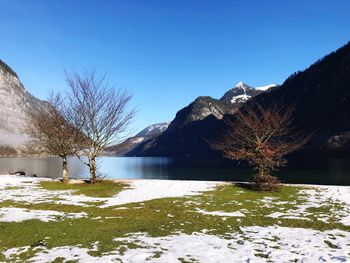 Scenic view of frozen lake against clear sky