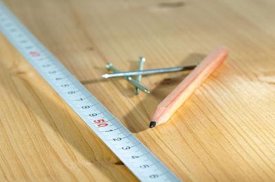 Close-up of work tools on wooden table