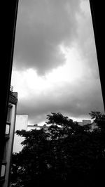 Low angle view of building against cloudy sky