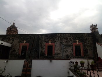 Low angle view of buildings against sky