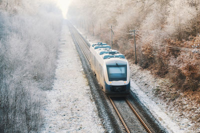 Train on railroad tracks during winter