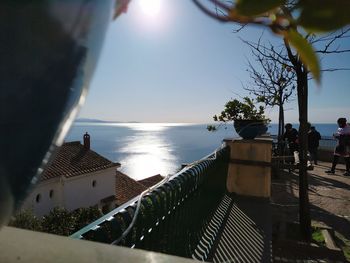 Scenic view of sea against sky on sunny day