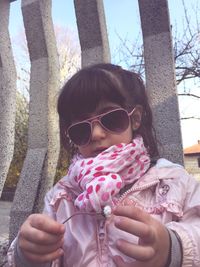 Close-up portrait of girl holding ice cream