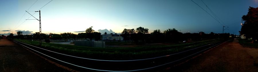 Electricity pylons against blue sky