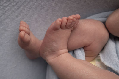High angle view of baby feet