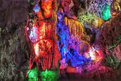 Low angle view of illuminated rock formation in cave