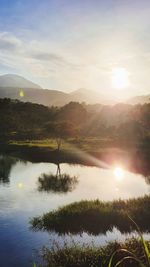 Scenic view of lake against sky during sunset