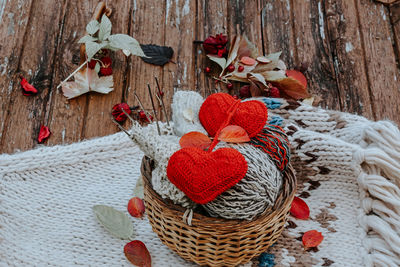 Autumn knitting of warm clothes. woolen balls of knitting needles knitted hearts. 