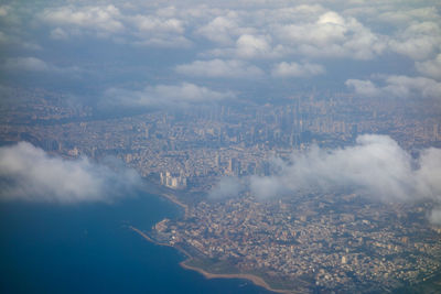 Aerial view of cityscape against sky