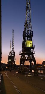 Ferris wheel against sky at sunset