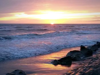 Scenic view of sea at sunset