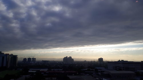 Cityscape against sky during sunset