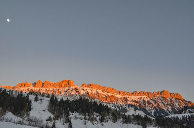 Scenic view of snowcapped mountains against clear sky