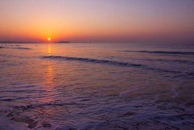 Scenic view of sea against sky during sunset