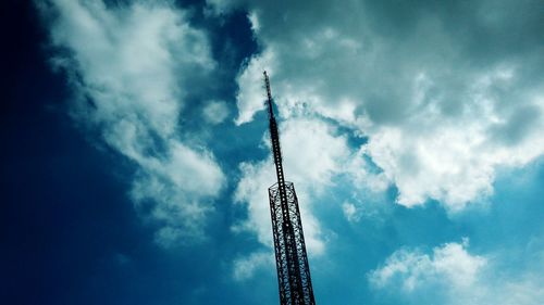 Low angle view of crane against sky