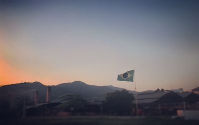 Scenic view of mountains against clear sky during sunset