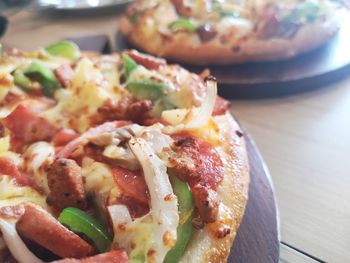 Close-up of pizza served on table