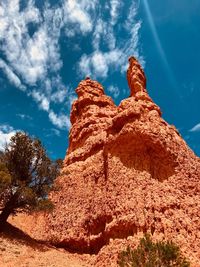 Low angle view of rock formation against sky
